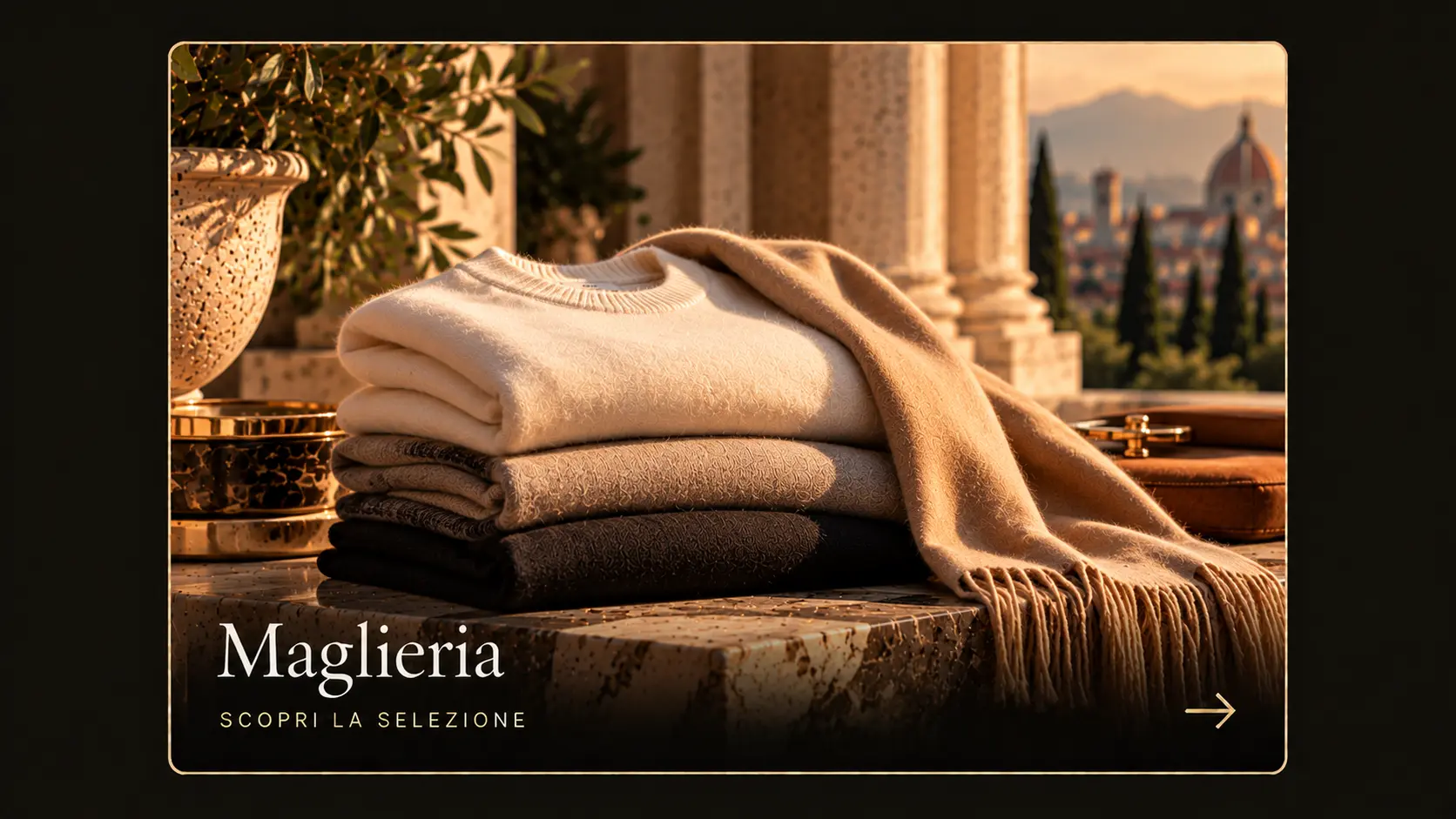 Gefaltete Kaschmirpullover und ein Schal auf Marmor, mit Blick auf Florenz bei Sonnenuntergang.